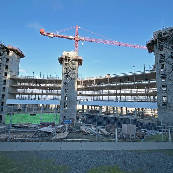 A construction site with a crane above