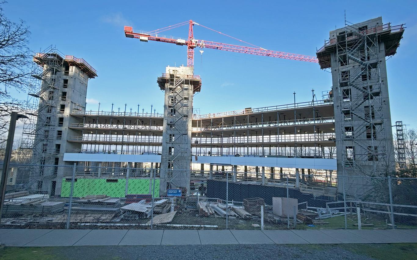 A construction site with a crane above